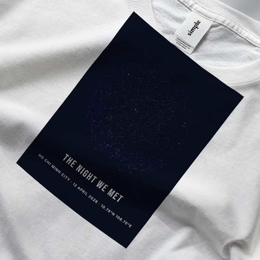 A night-sky print on the chest of a white tee, captioned The Night We Met