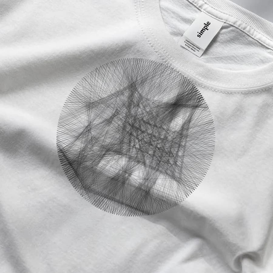 A circular string-art portrait printed on the chest of a white tee